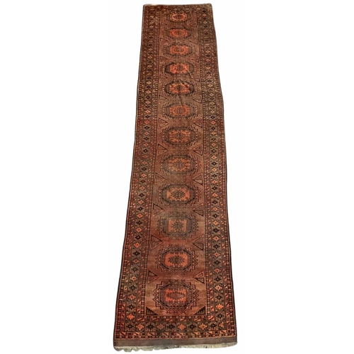 350A - Burt orange runner with central geometric octagon pattern, tribal/Oriental design, approx 430cm long... 