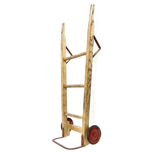 351B - A diminutive early 20th century pine and red-painted cast metal sack trolley, 76cm high Provenance: ... 