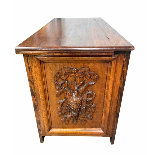 363 - Oak chest with relief carvings of game motifs, 73cm high, 126cm wide, 58cm deep (1)