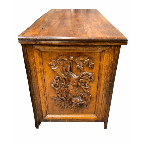 363 - Oak chest with relief carvings of game motifs, 73cm high, 126cm wide, 58cm deep (1)