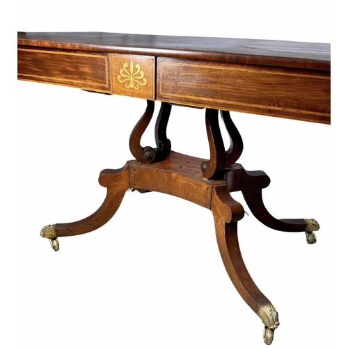 375 - A regency mahogany sofa table, drop down leaves, two pull out drawers, on splayed legs terminating i... 