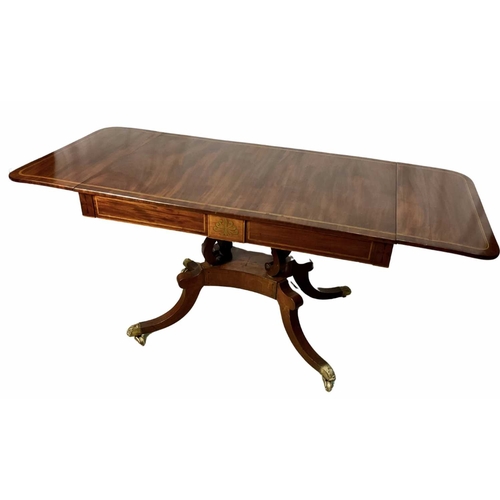 375 - A regency mahogany sofa table, drop down leaves, two pull out drawers, on splayed legs terminating i... 