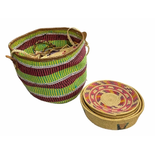 50 - A collection of mid-late 20th century African woven baskets of natural and dyed woven materials, mad... 