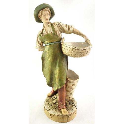 88 - A Royal Dux figure of a farm boy with basket, No. 1536, pink triangle mark, 42cm high