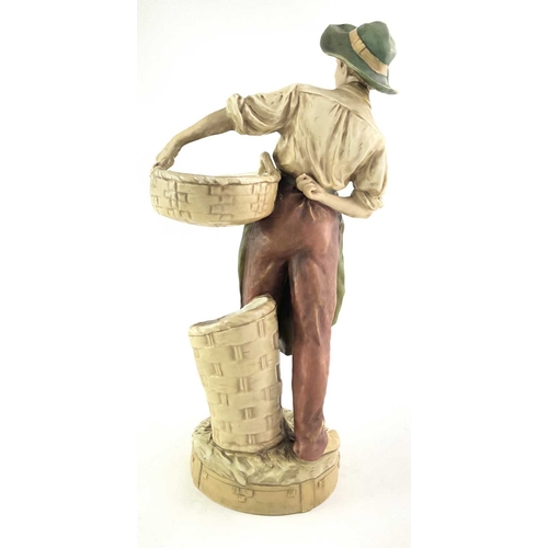 88 - A Royal Dux figure of a farm boy with basket, No. 1536, pink triangle mark, 42cm high