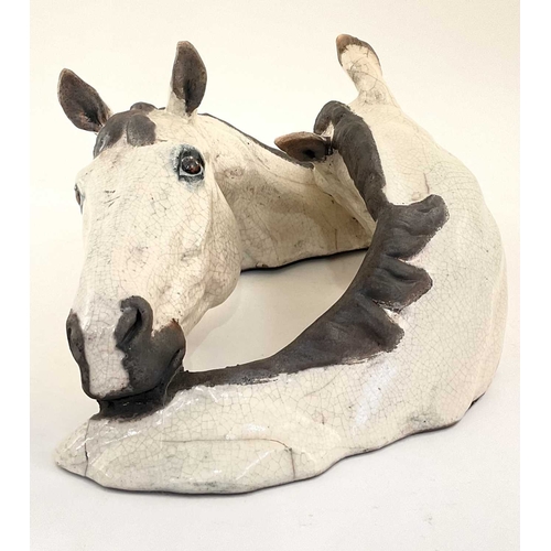 94 - Keza Rudge (British, 20th century), model of two intertwined horse heads, slip cast raku, signed to ... 