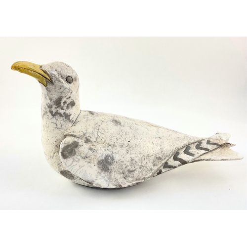 93 - Sylvia Owen, (British, contemporary), a raku-fired ceramic seagull sculpture, marks to base, 18cm hi... 