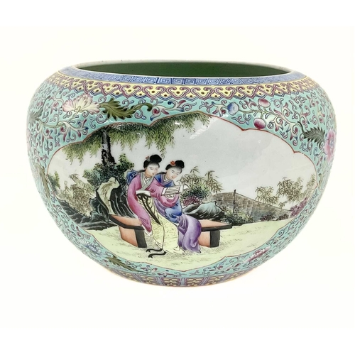 136 - A Chinese turquoise glaze bowl, painted with cartouche panels of figures in domestic settings, puce ... 