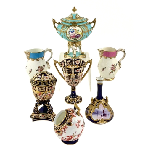 142 - A group of Royal Crown Derby cabinet pieces, including a turquoise ground twin-handled covered vase,... 