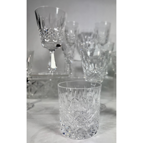 26 - A large part Waterford crystal suite, Kenmare cut, including eight wine goblets, over twenty five sh... 