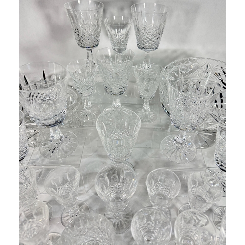 26 - A large part Waterford crystal suite, Kenmare cut, including eight wine goblets, over twenty five sh... 