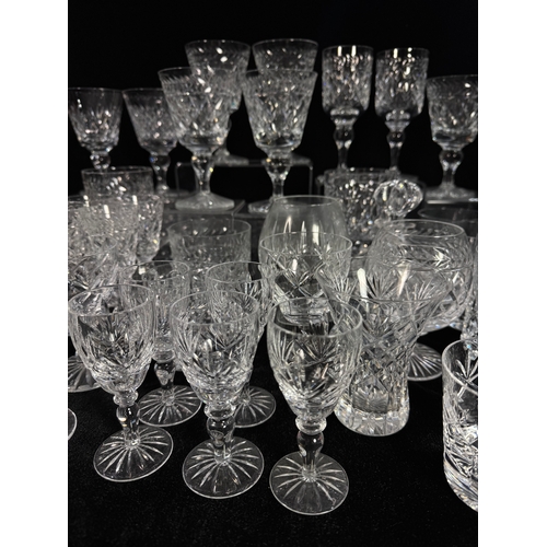 25 - A collection of glass including wine goblets, tumblers, sherry glasses, decanters etc., also a silve... 