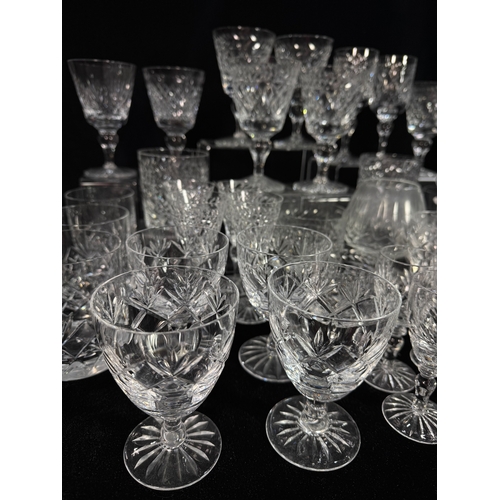 25 - A collection of glass including wine goblets, tumblers, sherry glasses, decanters etc., also a silve... 