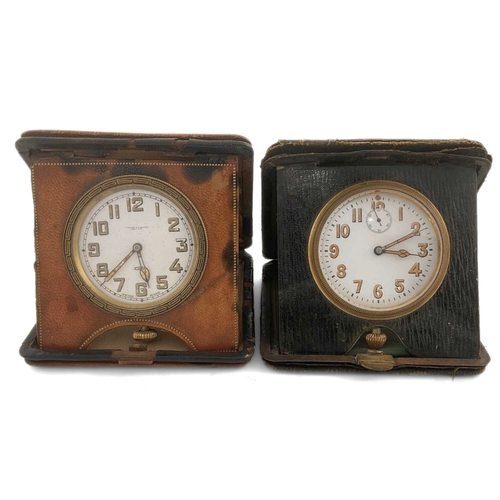 249 - Two leather-cased eight-day travel clocks, one by Cooke & Kelvey, with radium-painted numbers and ha... 