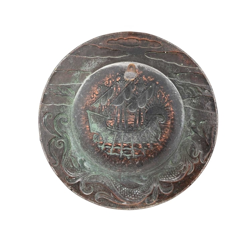 16 - John Pearson, an Arts and Crafts copper charger, 1895, wide brimmed circular form, repousse embossed... 