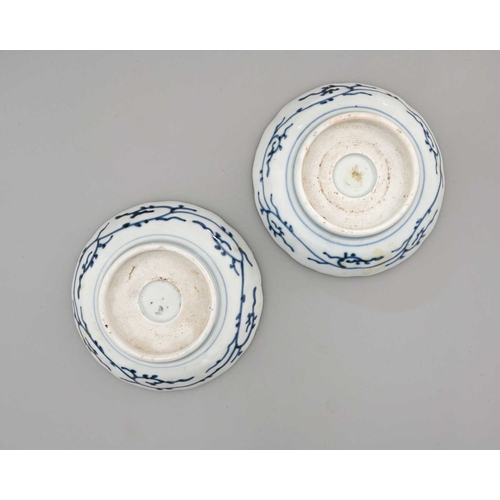 28 - A pair of Japanese Imari Arita porcelain dishes, ogee rimmed, painted with underglaze blue dragons, ... 