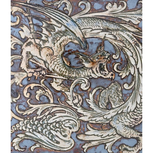 29 - Robert Wallace Martin for Martin Brothers, a stoneware panel of three dragon tiles, circa 1890, each... 