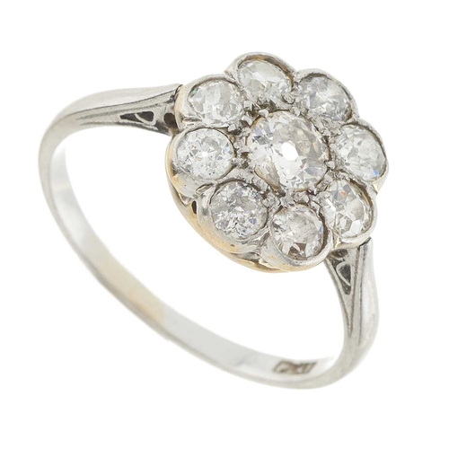 1 - An early 20th century platinum old-cut diamond cluster ring, estimated total diamond weight 1.10ct, ... 