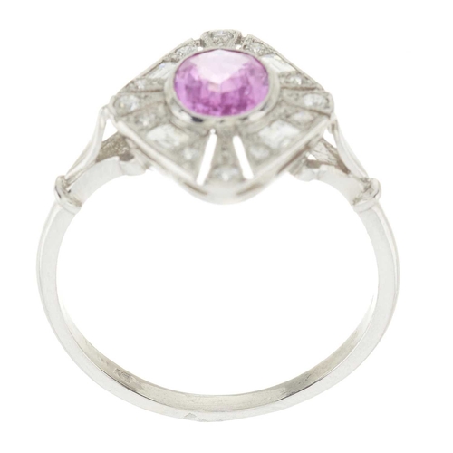 145 - A platinum pink sapphire and vari-cut diamond openwork dress ring, sapphire estimated weight 1ct, es... 