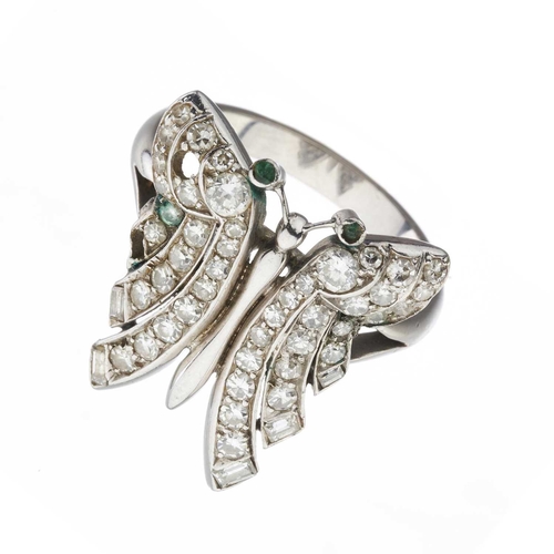 153 - A mid 20th century vari-cut diamond butterfly ring, with green gem eyes, estimated total diamond wei... 