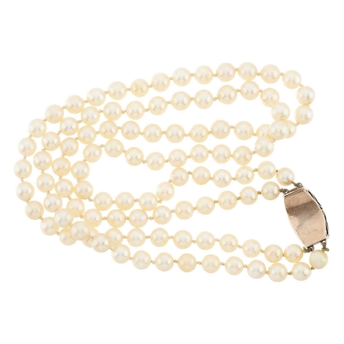 154 - An early to mid 20th century pearl two-row necklace, gathered to a gold and silver old-cut diamond c... 