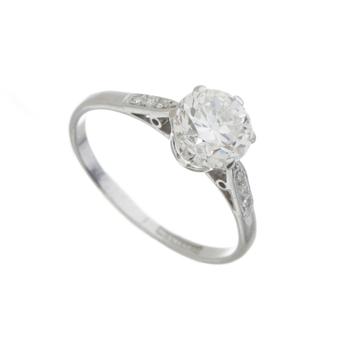 156 - An Art Deco platinum transitional-cut diamond single-stone ring, with diamond shoulders, principal d... 