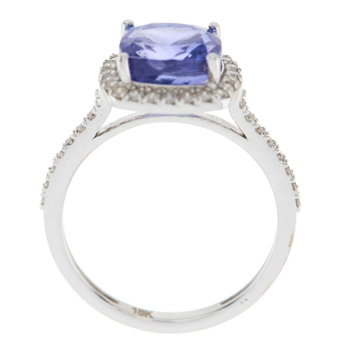 204 - An 18ct gold tanzanite and brilliant-cut diamond cluster ring, with similarly-cut diamond line shoul... 