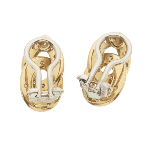 212 - A pair of 18ct gold clip earrings, each designed as two brilliant-cut diamond accent interlocking ov... 