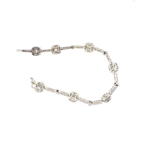 214 - A 14ct gold diamond cluster line bracelet, estimated total diamond weight 2.75ct, H-I colour, SI1-P1... 