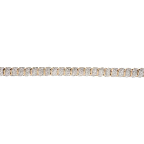 224 - A 9ct gold pave-set diamond bracelet, with partially concealed push-piece clasp, estimated total dia... 