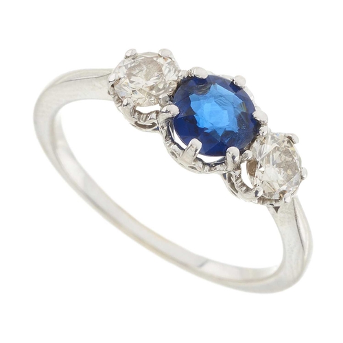 228 - An 18ct gold sapphire and diamond three-stone ring, estimated total diamond weight 0.50ct, I-J colou... 