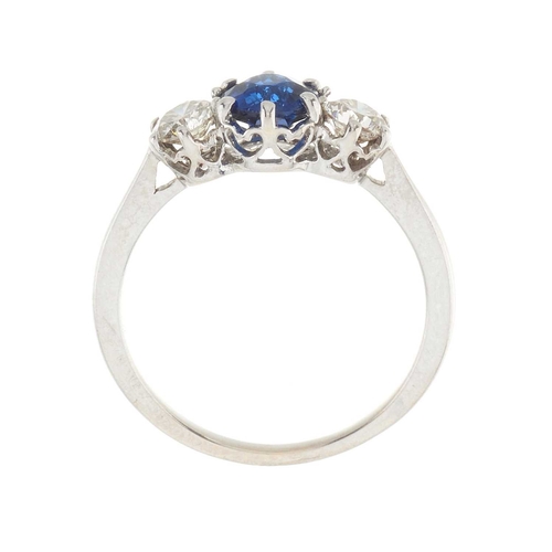 228 - An 18ct gold sapphire and diamond three-stone ring, estimated total diamond weight 0.50ct, I-J colou... 