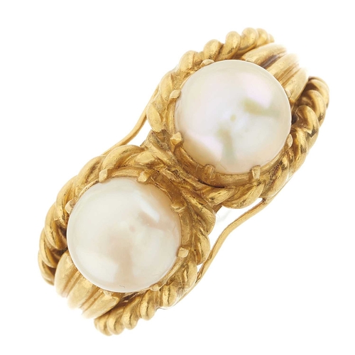 232 - A 22ct gold pearl two-stone ring, with rope-twist band and grooved shoulders, pearls measure approxi... 