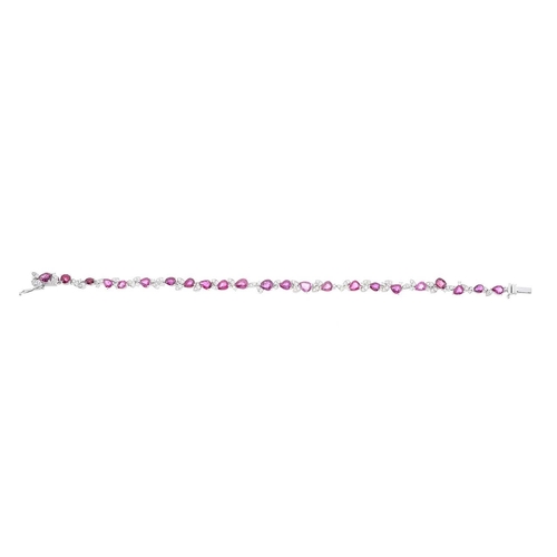 251 - A platinum ruby and brilliant-cut diamond line bracelet, with push-piece clasp, total ruby weight 6.... 