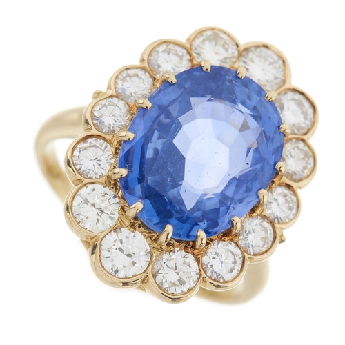 254 - An 18ct gold sapphire and brilliant-cut diamond cluster ring, sapphire estimated weight 7.60ct, esti... 