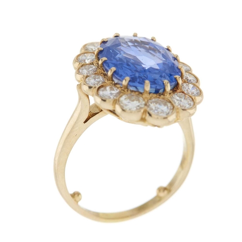 254 - An 18ct gold sapphire and brilliant-cut diamond cluster ring, sapphire estimated weight 7.60ct, esti... 