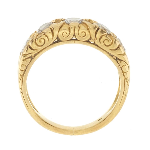 259 - A 20ct gold brilliant-cut diamond five-stone band ring, with scrolling gallery, estimated total diam... 