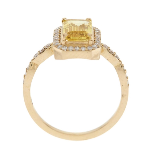 262 - A 14ct gold citrine and brilliant-cut diamond cluster dress ring, with similarly-cut diamond line sh... 