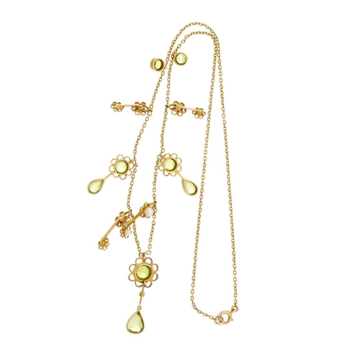 3 - An Edwardian 15ct gold vari-shape peridot and seed pearl floral fringe necklace, mount stamped 15c, ... 