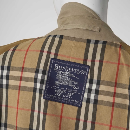 346 - Burberry, a ladies classic trench coat, designed with a notched lapel collar, buttoned epaulettes, d... 