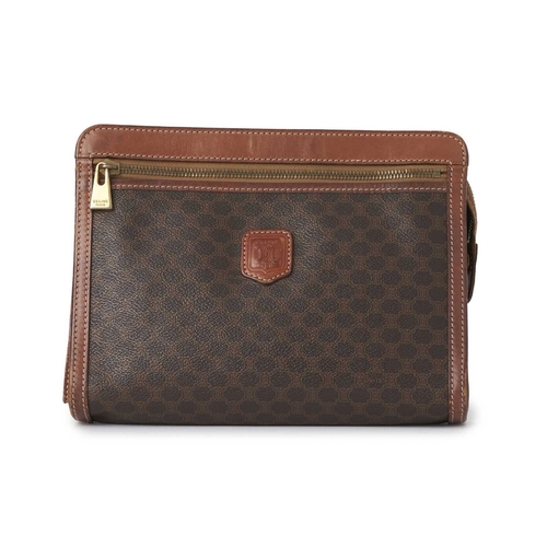 355 - Celine, a vintage Macadam wristlet clutch, featuring the maker's brown monogram coated canvas exteri... 