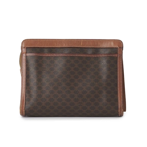 355 - Celine, a vintage Macadam wristlet clutch, featuring the maker's brown monogram coated canvas exteri... 