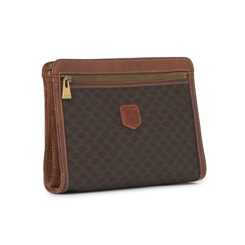 355 - Celine, a vintage Macadam wristlet clutch, featuring the maker's brown monogram coated canvas exteri... 