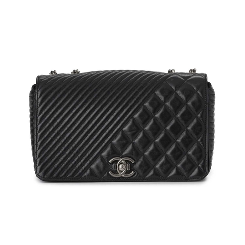 364 - Chanel, a Medium Coco Boy Flap handbag, featuring a quilted glazed black calfskin leather exterior, ... 