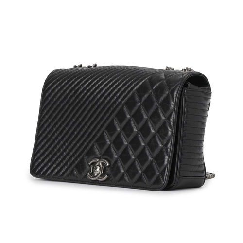 364 - Chanel, a Medium Coco Boy Flap handbag, featuring a quilted glazed black calfskin leather exterior, ... 