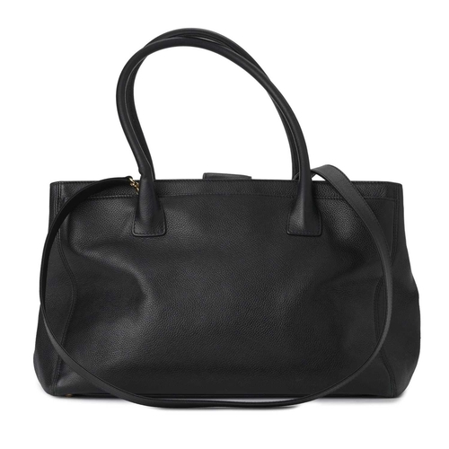 369 - Chanel, a Cerf Executive tote, crafted from black calfskin leather, featuring dual-rolled leather ha... 