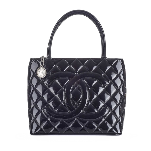 372 - Chanel, a Timeless Medallion tote, crafted from black patent leather with the maker's classic diamon... 