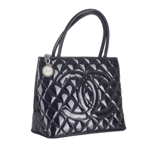 372 - Chanel, a Timeless Medallion tote, crafted from black patent leather with the maker's classic diamon... 