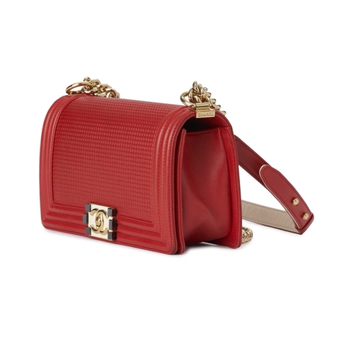 373 - Chanel, a Medium Cube Embossed Boy handbag, crafted from red leather, designed with a cube embossed ... 