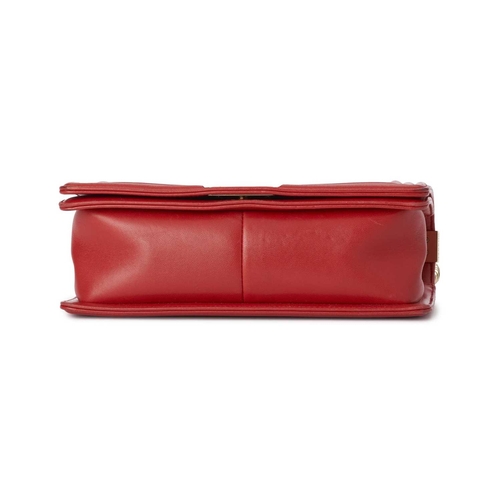 373 - Chanel, a Medium Cube Embossed Boy handbag, crafted from red leather, designed with a cube embossed ... 